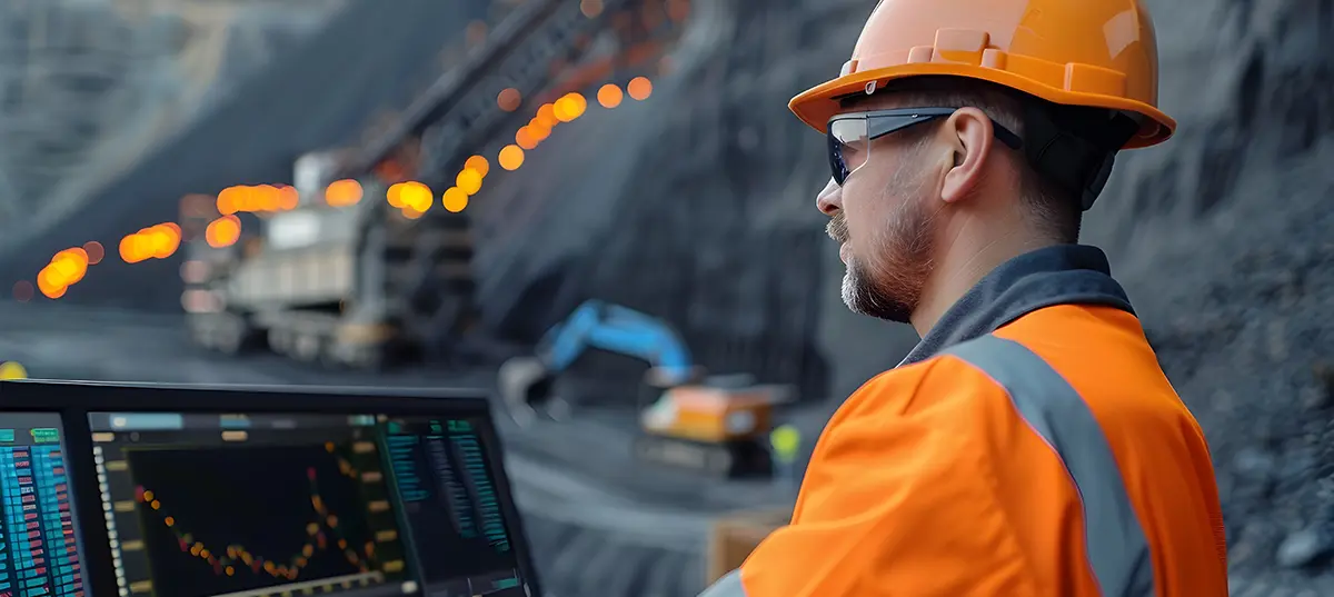 An IT consultant on-site at a mine or facility understanding the operation before reviewing the technology.