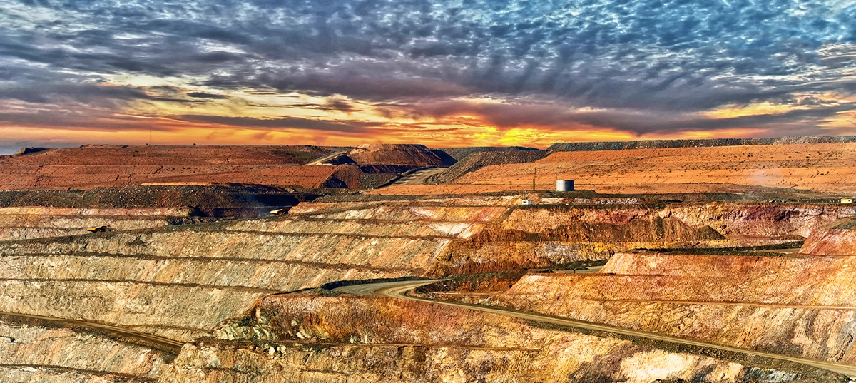Aerial view of open cut mine representing risk assessment in Australian resources operations.